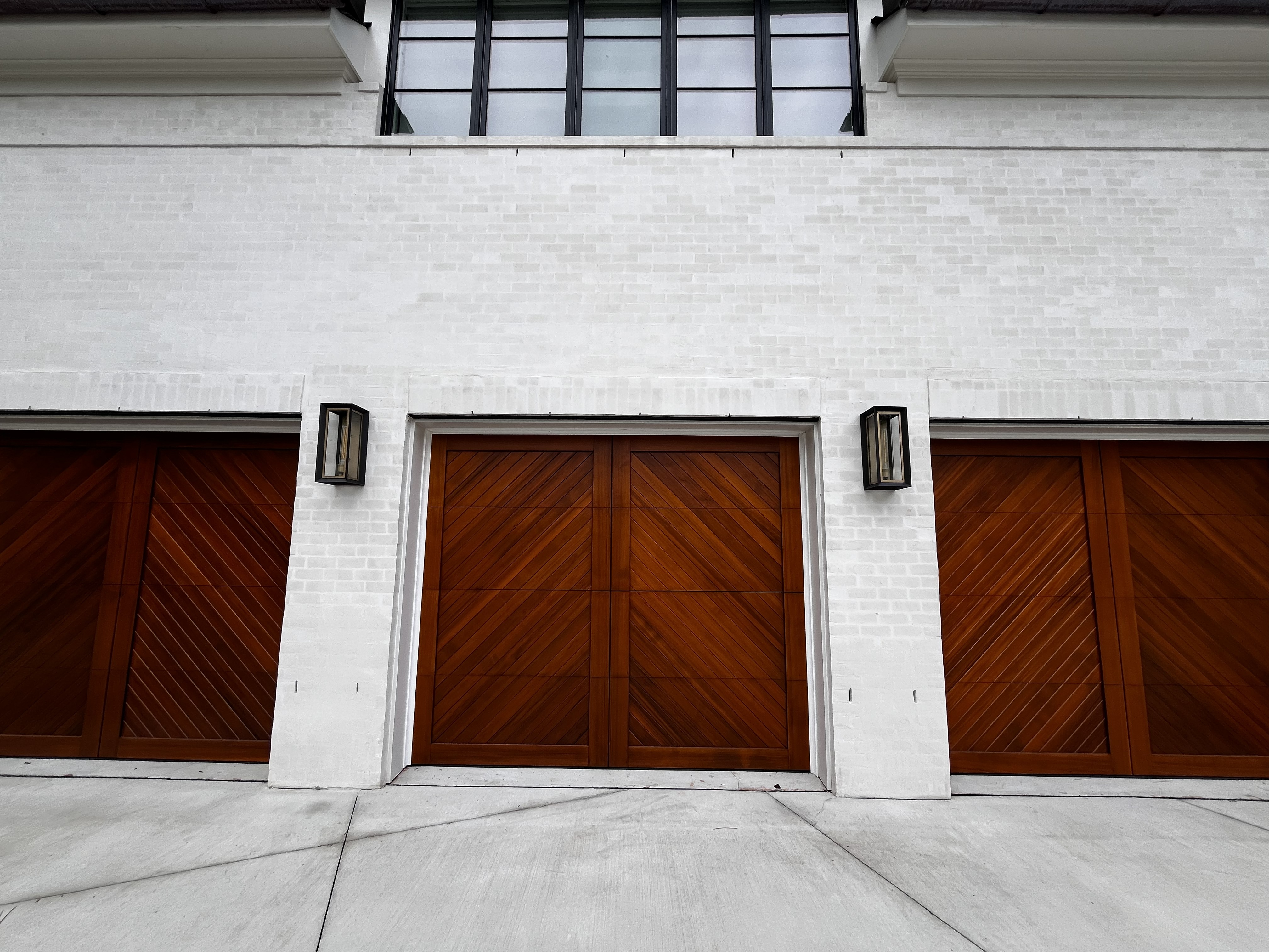 Custom white brick home by SD Masonry
