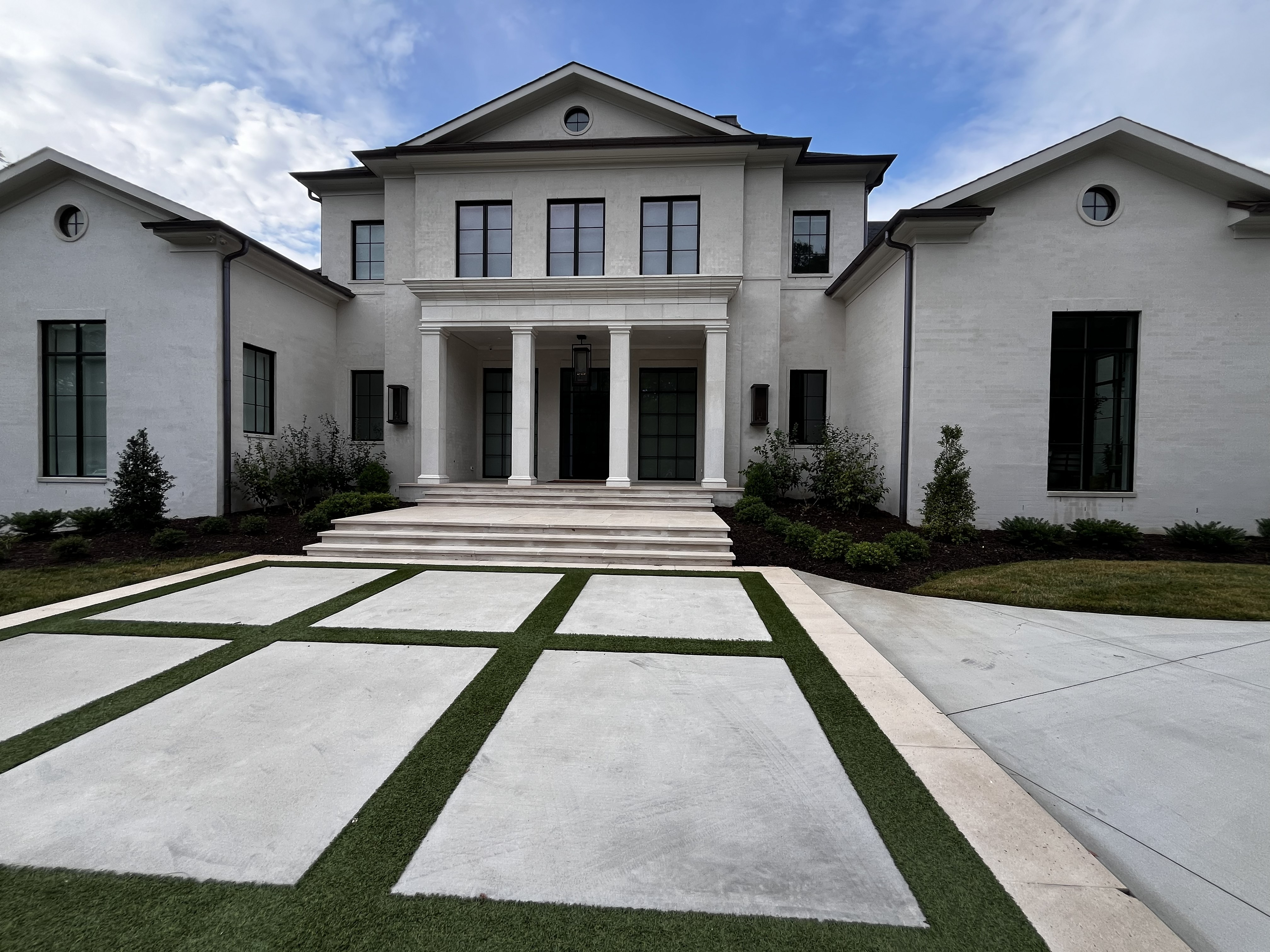 Luxury custom brick home exterior by SD Masonry in Charlotte, NC