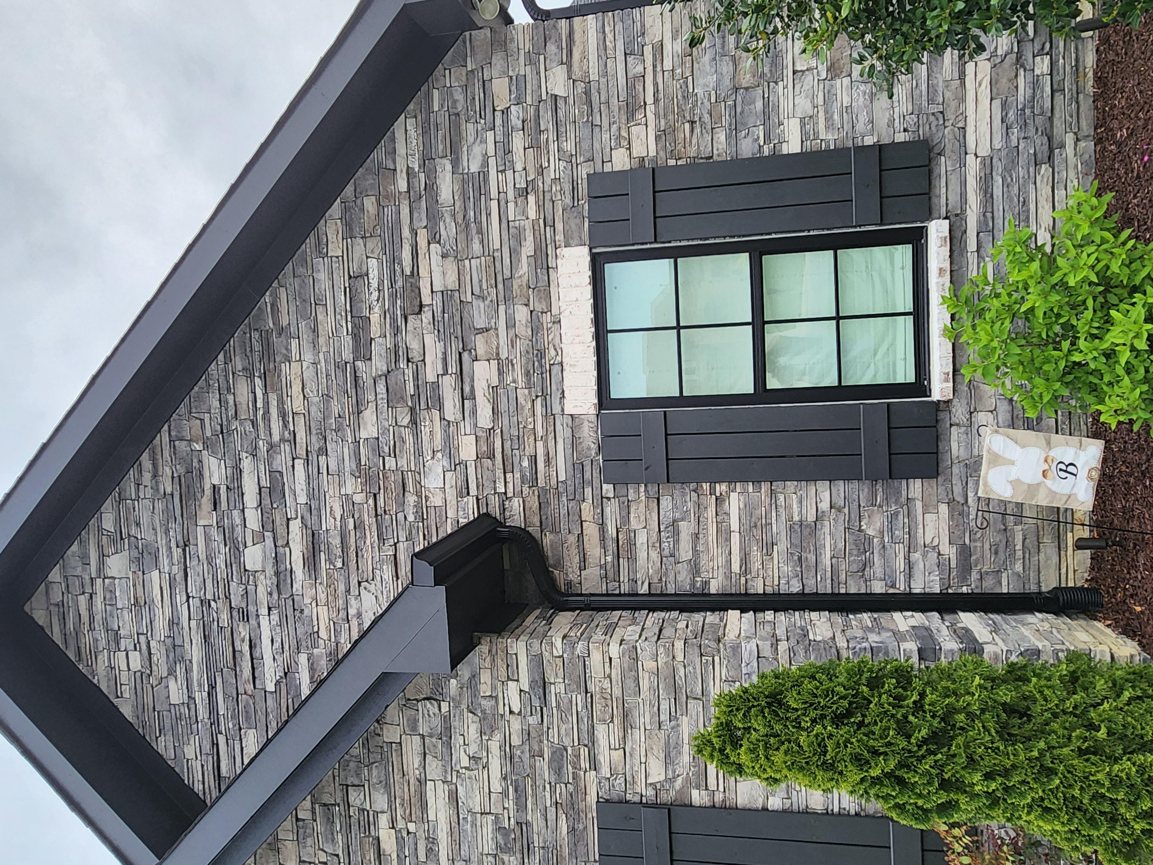 Stacked stone veneer home exterior by SD Masonry